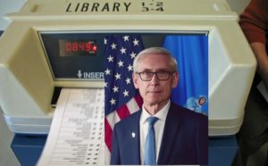 Ballot machine with portrait of Governor Evers superimposed over it